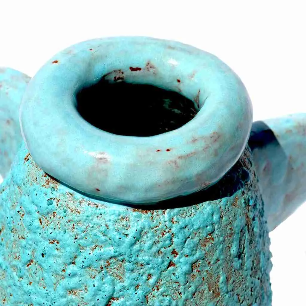 close up of cute turquoise angel pot