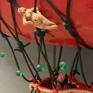 tiny Goddess on ceramic chilli zeppelin sculpture by Emma Plunkett