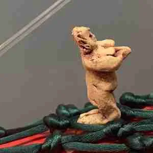 tiny goddess crew on ceramic chilli zeppelin sculpture by Emma Plunkett