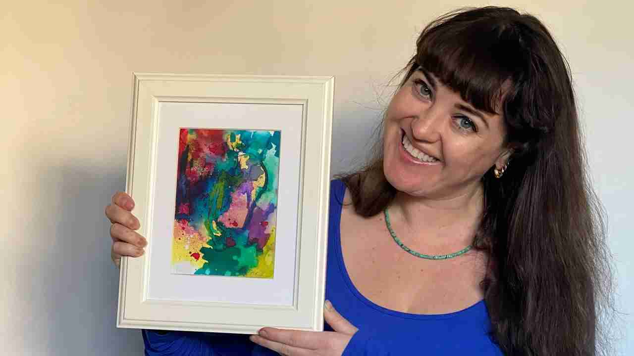 Maggie Field with her painting made in Emma Plunkett's art studio