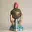 A surreal stoneware sculpture with a strawberry