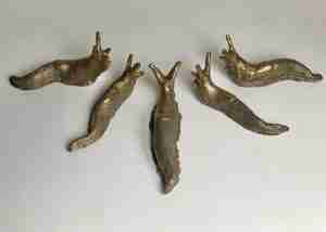 stoneware golden ceramic slug sculpture