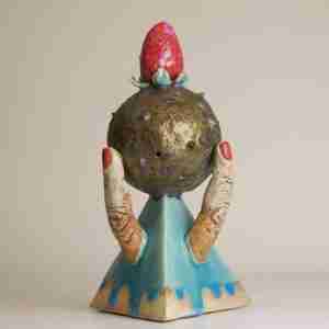 Stoneware surreal sculpture with geometric shapes and a strawberry