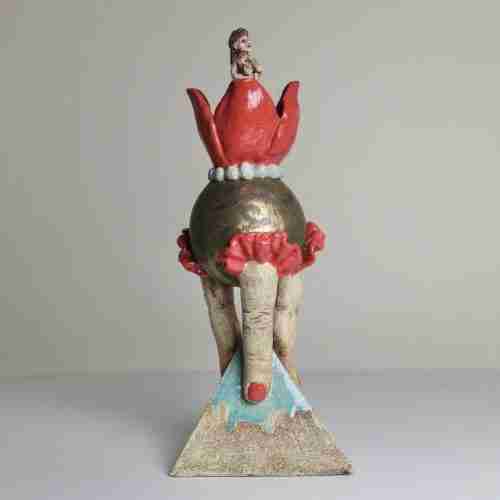 Surreal stoneware sculpture with tulip