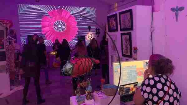 VJ Miss Plunkett, with screen at an art event