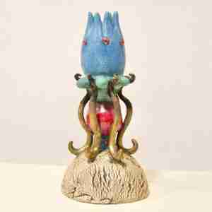 Stoneware surreal sculpture with geometric shapes and nature