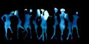 Ethereal layered video art with pale blue pregnant dancer