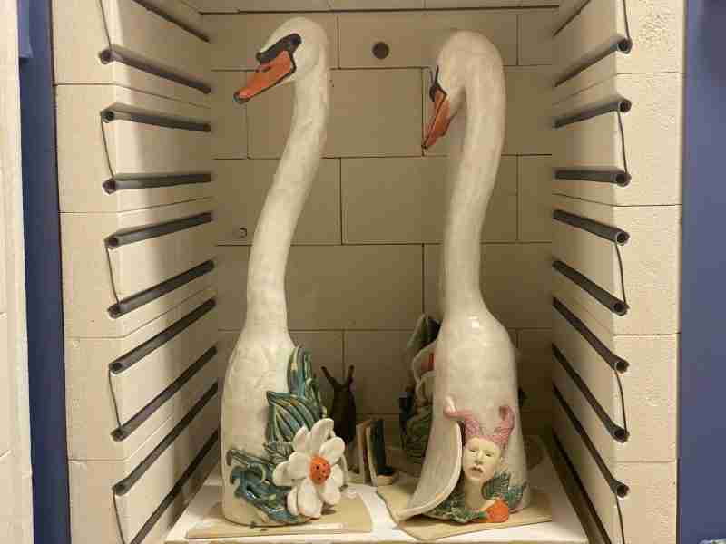ceramic swan sculptures in the kiln, fired to stoneware