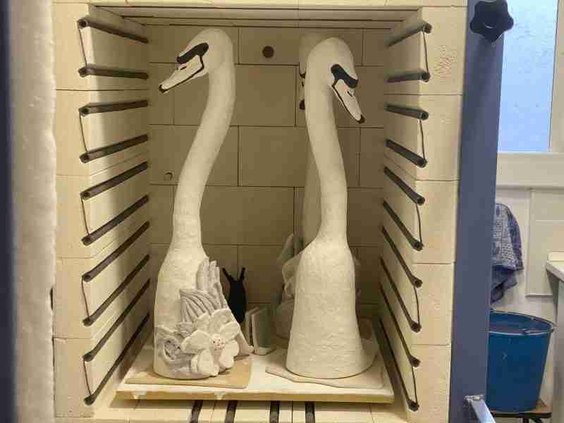 ceramic swan sculptures go in the kiln