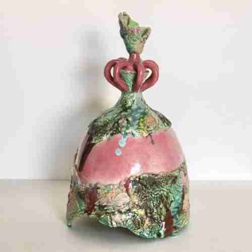 A highly glazed stoneware sculpture of a female ceramic form