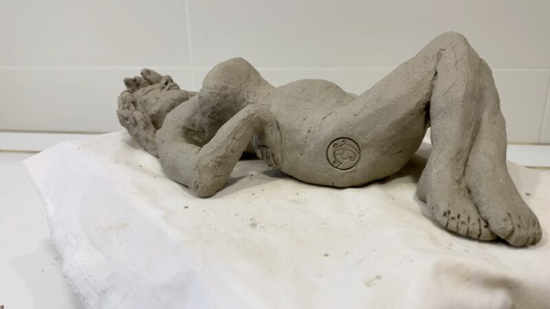 Makers mark on a figure in the clay