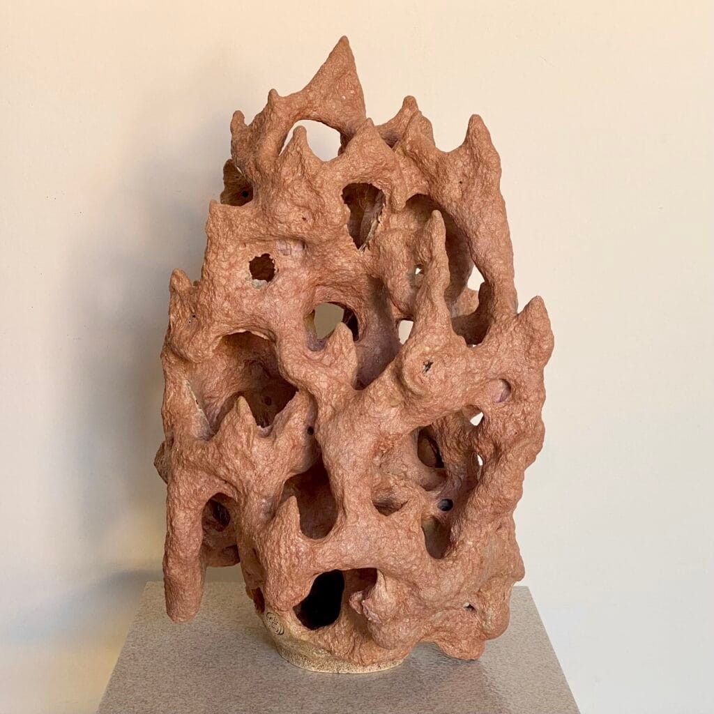 Stoneware sculpture: rose gold lava glaze over reef like form